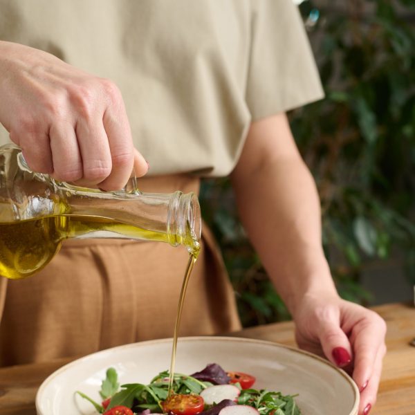 A Cook Fills a Salad with Oil Free Stock Photo by Everypixel (1) A Cook Fills a Salad with Oil Free Stock Photo by Everypixel (1)